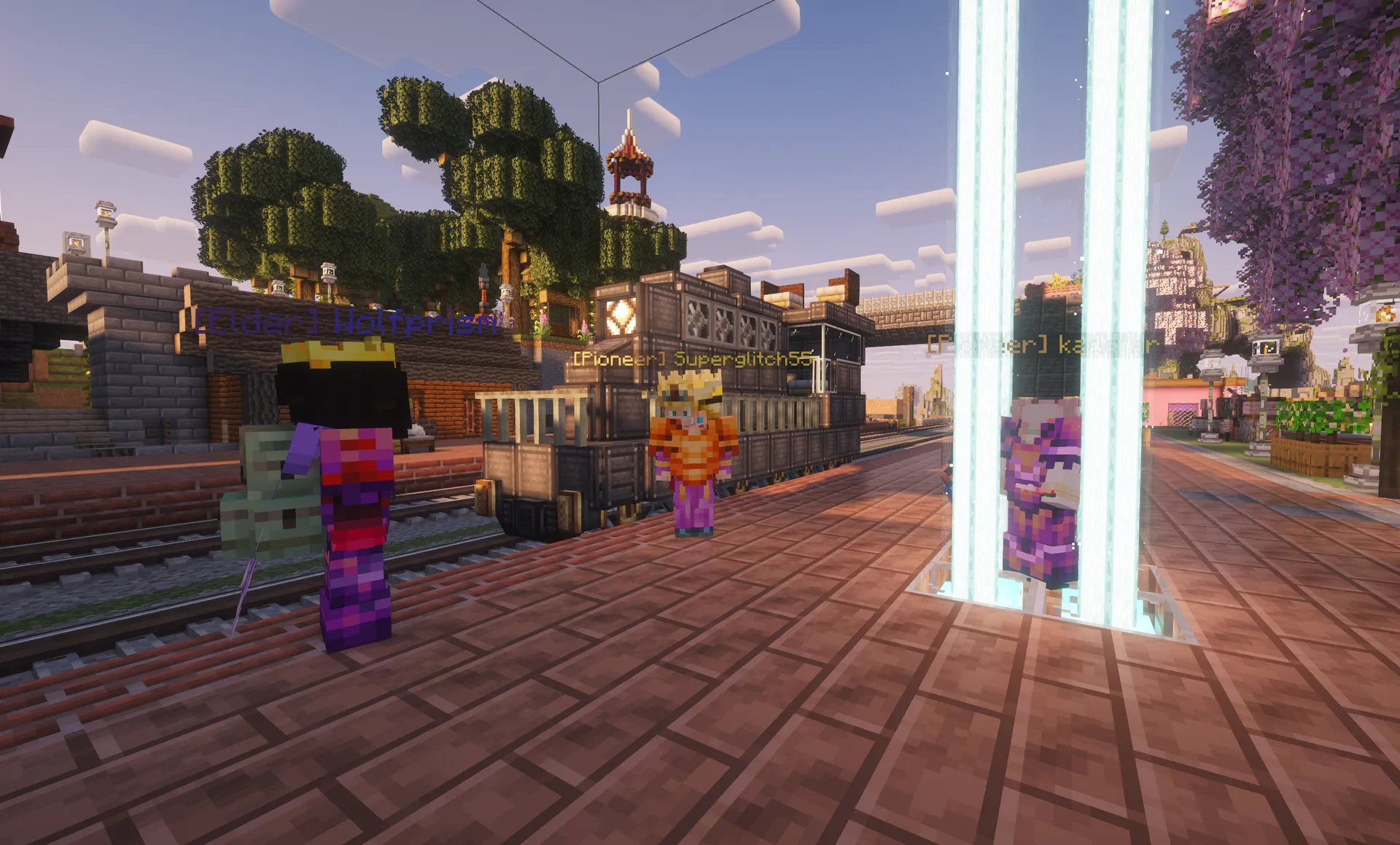 Three players stand together on a town platform with rooftops and cherry blossoms in the background.