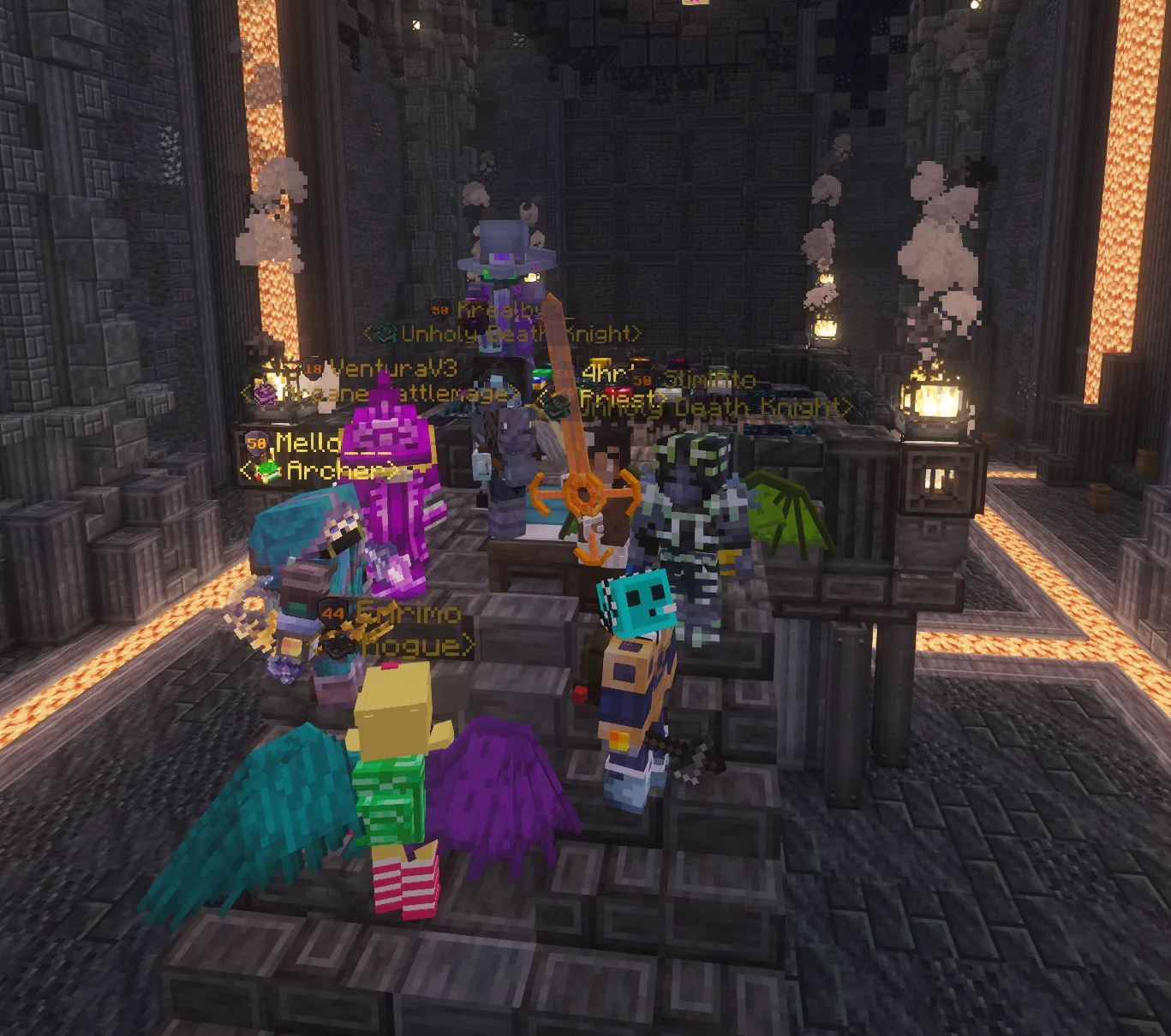 A costumed group of players gathers together inside a torch-lit stone hall.