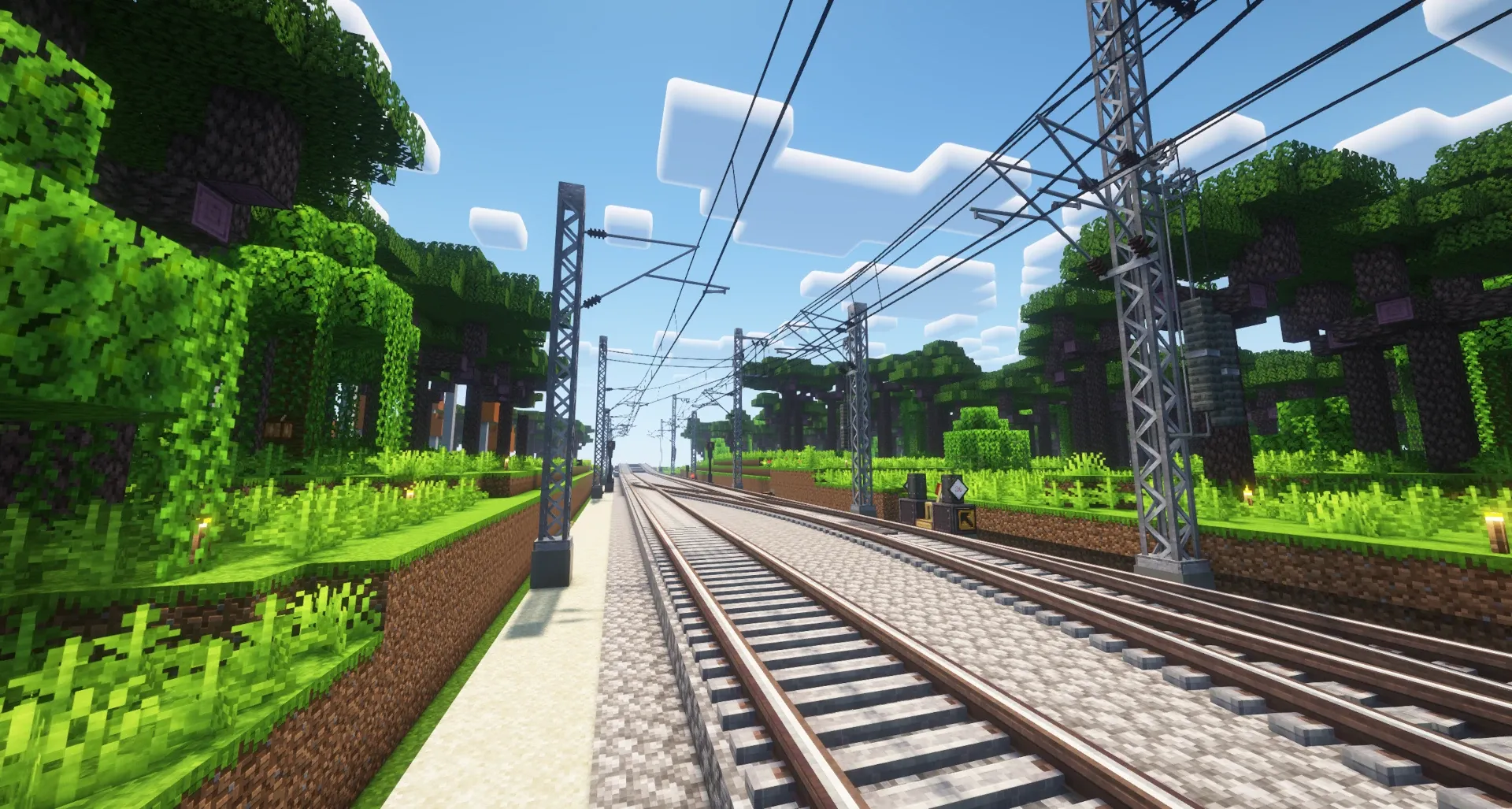 Overhead pantograph wiring strung above a Create rail line.