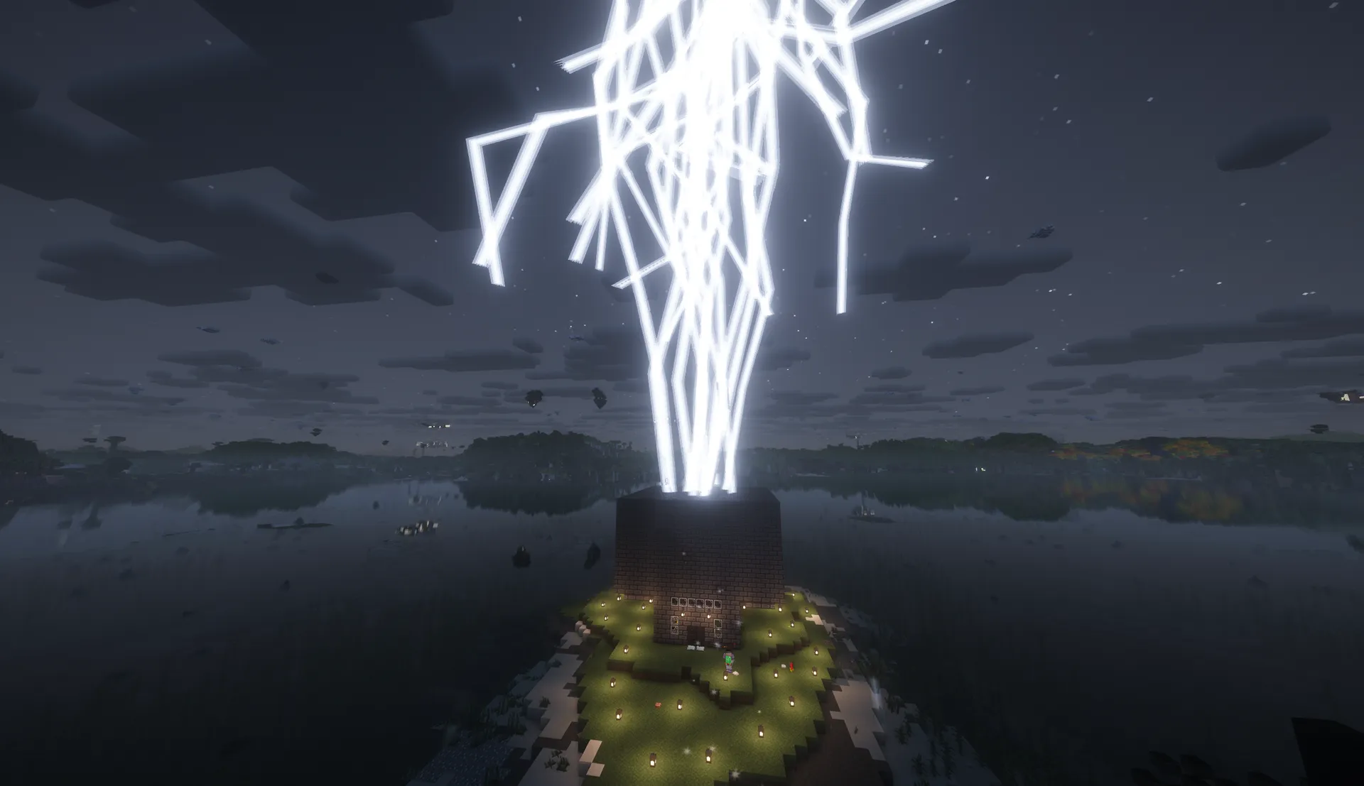 Bright branching lightning erupts above a lit lakeside base under a dark sky.