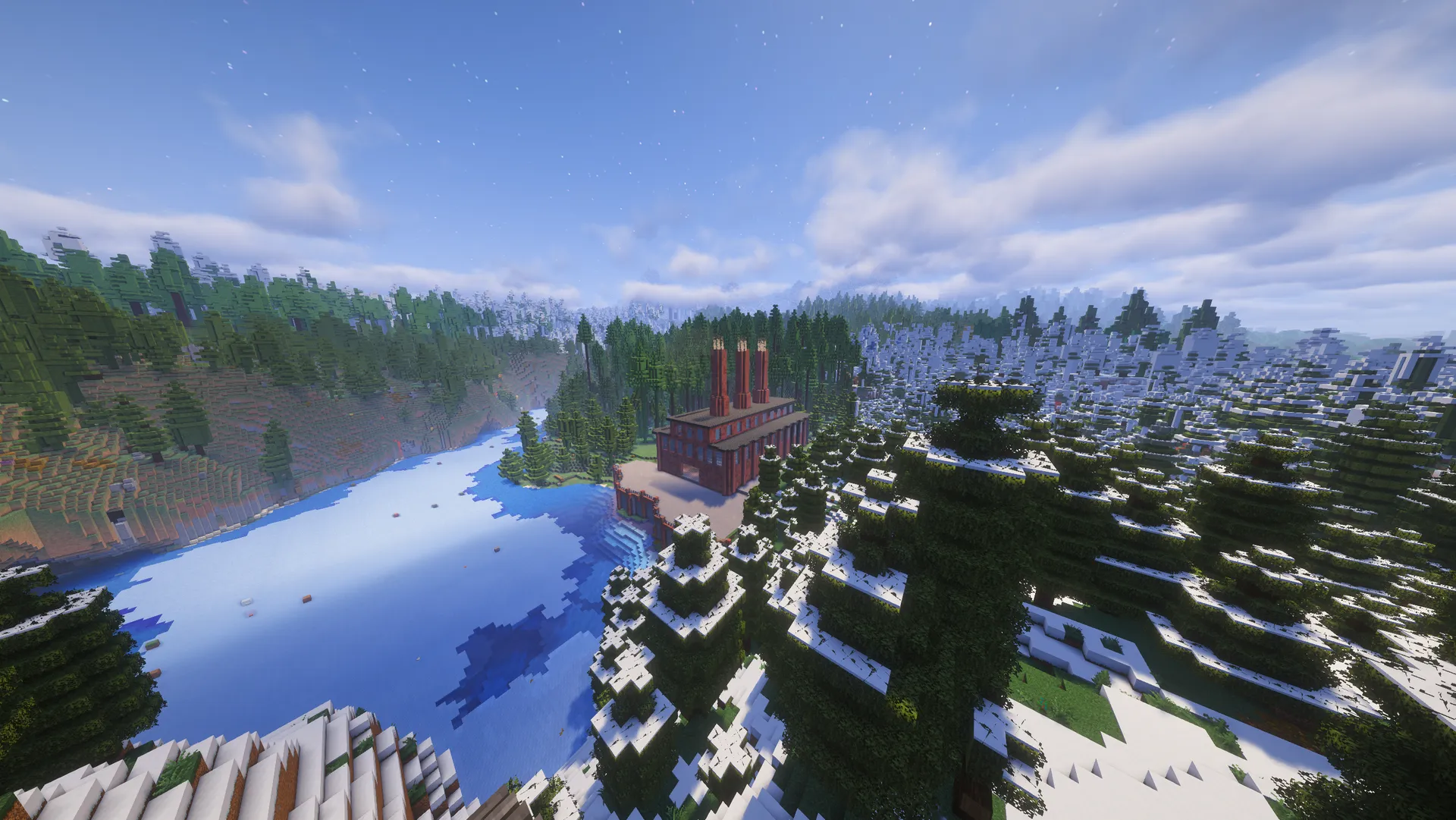 A red-brick factory with three tall chimneys stands beside a frozen lake, surrounded by snowy spruce forest and distant mountains.