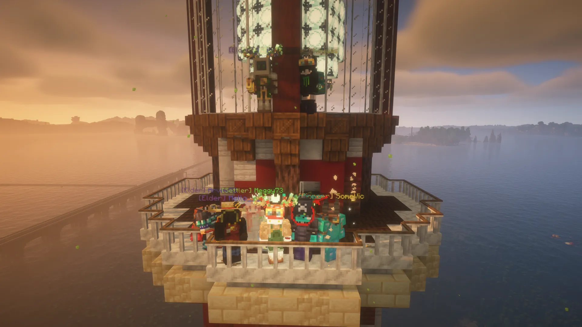 A group of players gathers on the lighthouse balcony at sunset, with warm light over the water.