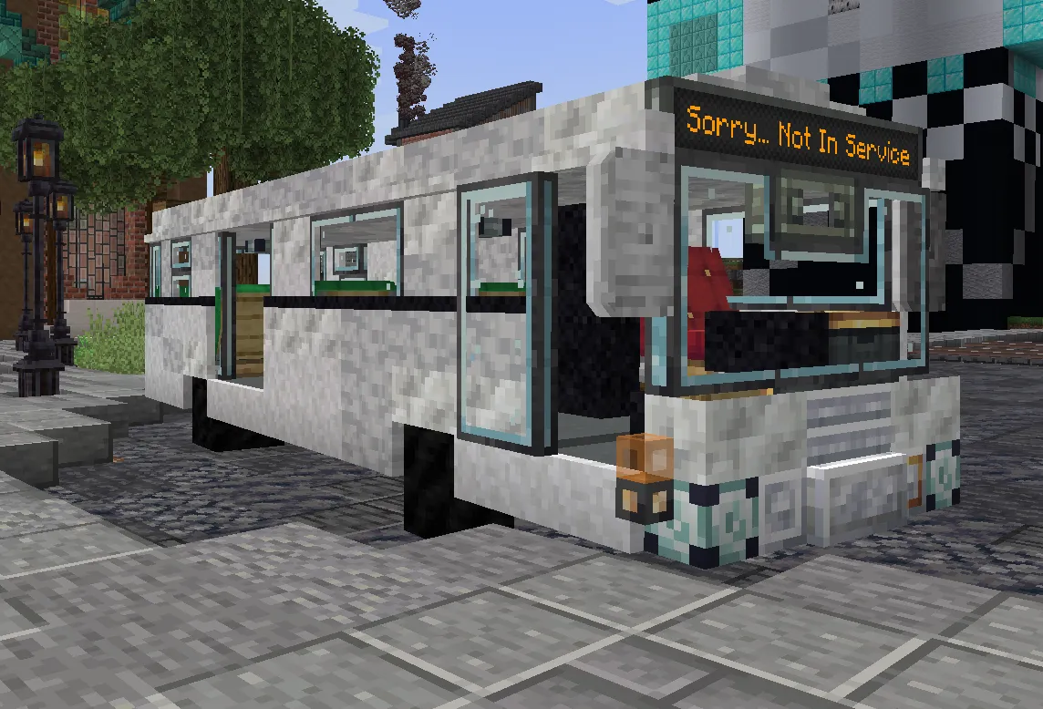 A white BRA city bus parked on a paved loop at spawn, its front display reading “Sorry... Not In Service.”