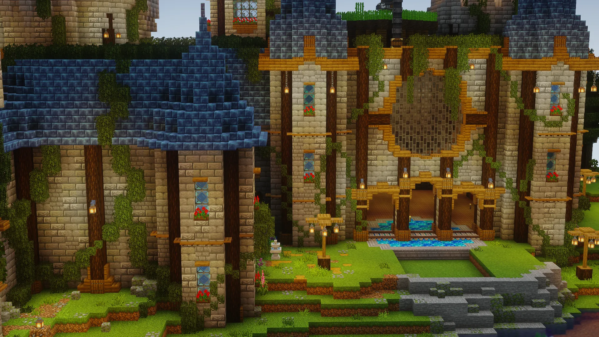 A sprawling stone-and-timber castle with blue roofs, vines, flower boxes, lanterns, and a grand arched entrance.