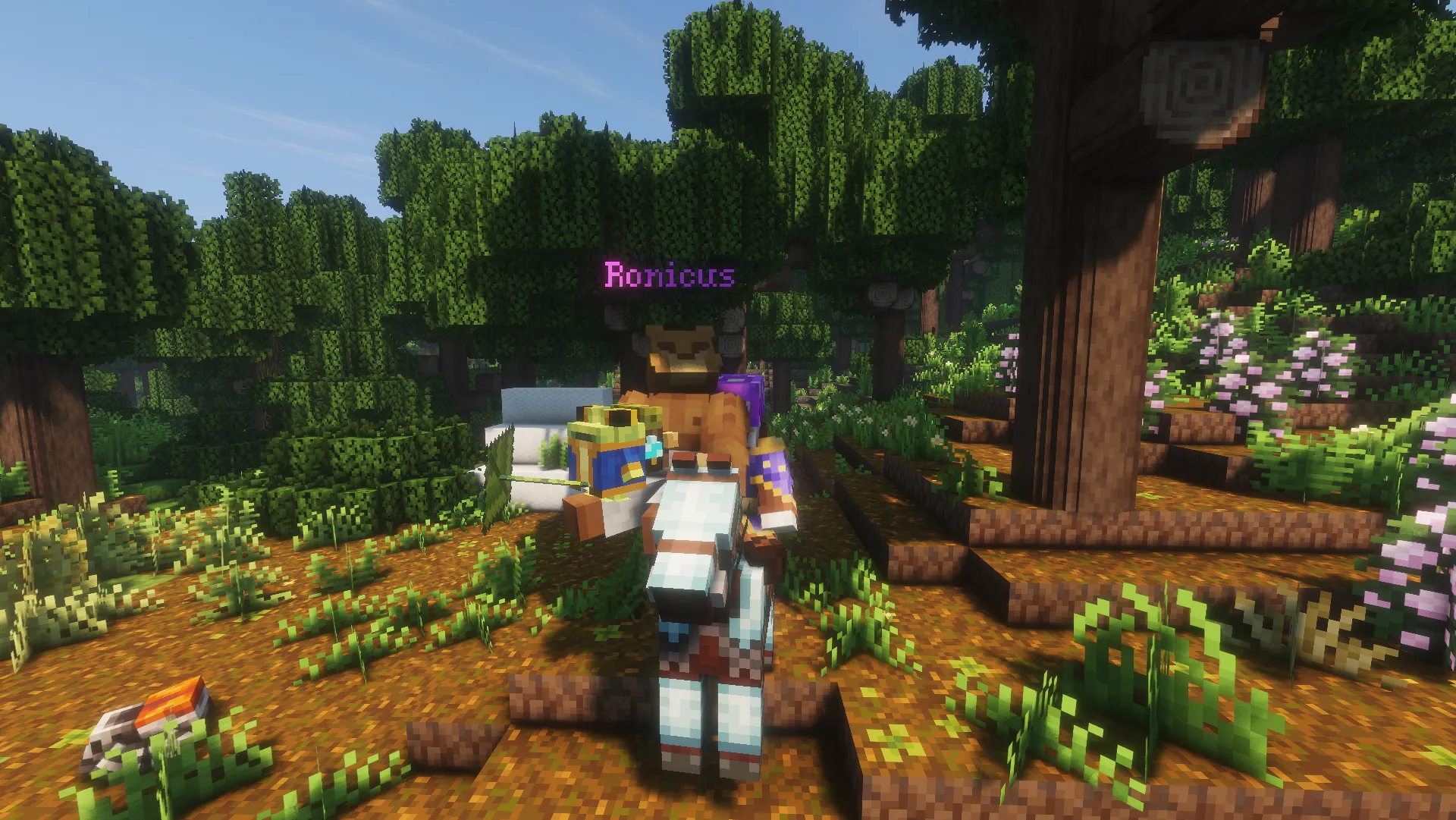 Ronicus sits atop a white horse in a sunlit FaeBourne forest with a small, colorful creature stack in front.